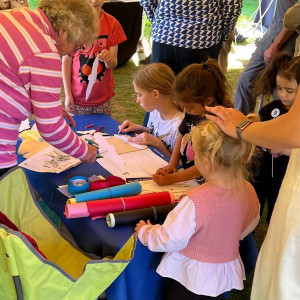 Crafting with some children at a public event. 